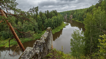 landscape with river, forest and rock on the side