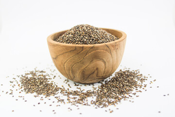 Closeup Chia Seed in wood bowl on a white background