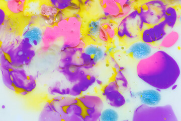 Closeup abstract color mixing of water, acrylic, oil and milk 