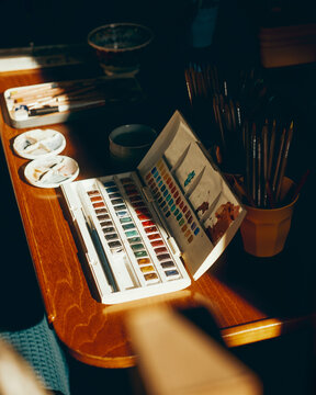 artist's table and materials in the sun