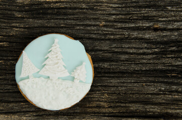 Christmas ball iced gingerbread cookies on a old textured wood background. Home made. Food backgrund.