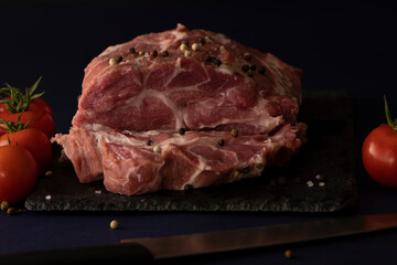 
pork, fresh meat with spices and salt on black. raw steak, tenderloin. semi-finished meat. dish ingredient