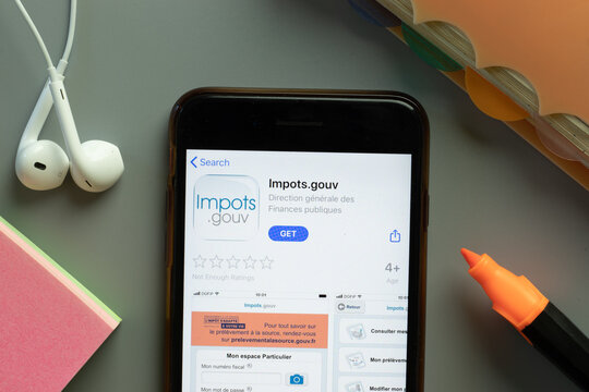 New York, USA - 1 December 2020: Impots.gouv mobile app icon on phone screen top view, Illustrative Editorial