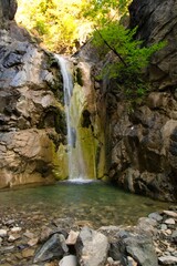 Fototapeta na wymiar waterfall in the forest in Mesolouri Grevena