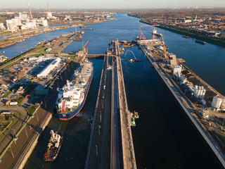 Aerial drone view of a big sluice sea port going towards Amsterdam near Ijmuiden and Velsen Noord a...