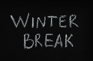 Phrase Winter Break written on black chalkboard. Holidays concept