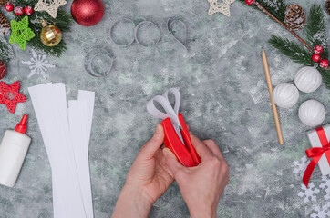 Christmas diy craft, making three-dimensional paper decor for decorating a room. Step-by-step instructions. Step 22 - fix the fourth decor element with a stapler