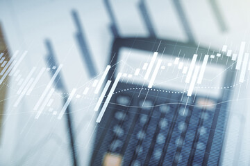 Abstract virtual financial graph hologram on calculator background, forex and investment concept. Multiexposure