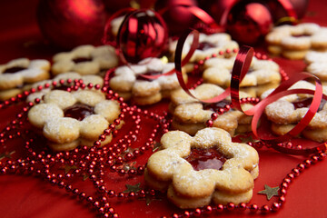 Christmas cookies and decorations on a red background.