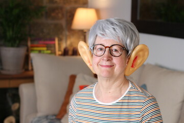 Senior woman with large ears - obrazy, fototapety, plakaty
