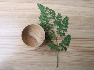 moringa leave and wood bowl
