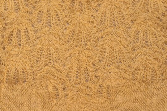 Yellow Knitted Cloth With Tracery And Paterns. Fluffy Yarn, Creative Handmade Background Or Wallpaper Template. Copy Space. Empty Space