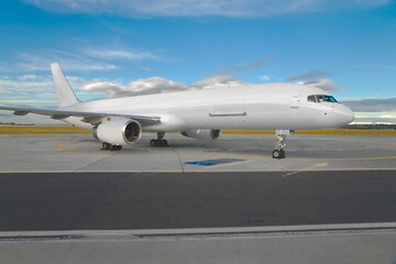 Fototapeta na wymiar Cargo plane at an airport blank white livery