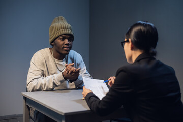 The suspect and his lawyer are considering a case management and defense strategy for appearing in court.