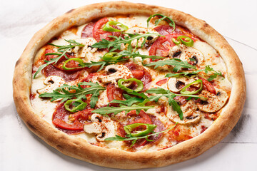 Italian Pizza with mushrooms, salami, tomatoes, cheese, spices, arugula and hot pepper
