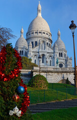 The famous basilica Sacre Coeur and Christmas tree , Paris, France.