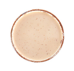 Delicious Christmas liqueur in glass on white background, top view