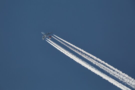 Plane at cruising altitude against blue sky