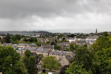 Fototapeta na wymiar Cityscape of Elgin city with typical Scottish architecture, grey houses and rooftops