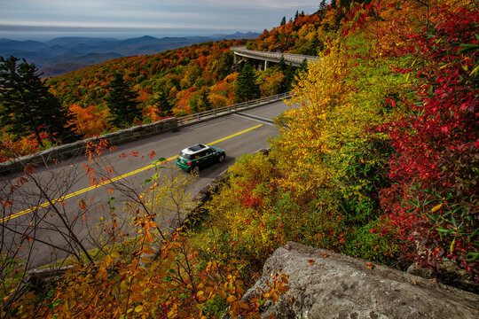 Tourists admiring the fall colors of The Blue Ridge Parkway in North Carolina