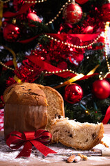 traditional christmas panettone on wooden table with decorations