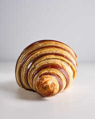 Fresh gentle croissant decorated with chocolate with chocolate creamy filling isolated on white background