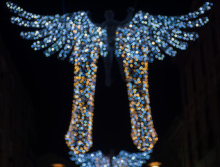 Obraz premium Colorful sparkling winter decorations, illuminated at night.