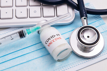 coronavirus vaccine vial in healthcare medical background