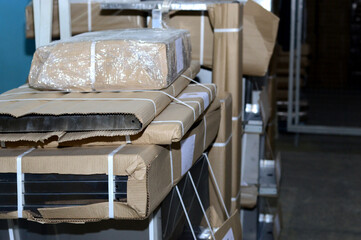 warehouse with metal products in cardboard packaging.