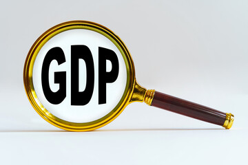 Magnifier on a white background, inside the text is written - GDP