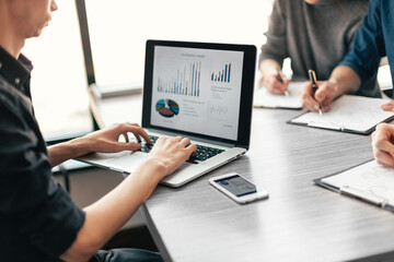 close up. a young man is working on a laptop in the office.