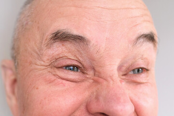 funny face of european adult man close up, wrinkles on aging skin, actor's grimaces, human...