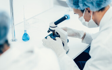 close up. group of scientists conduct research in the laboratory .