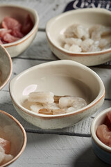 bowl of boiled gambas isolated on wood background