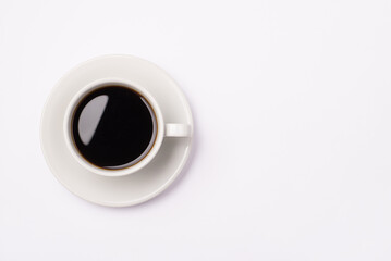 Top above overhead close up view photo of one cup of dark espresso on plate isolated white color background with empty space