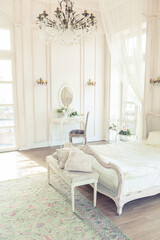 beautiful white bright clean interior bedroom in luxurious baroque style.