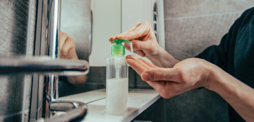 close up. man pressing the dispenser with bactericidal soap.