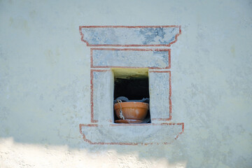 Old painted farmhouse window in Zabrdo village in Slovenia