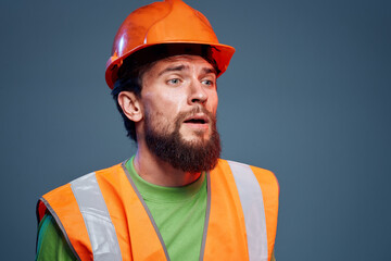 Angry man in work uniform orange paint safety hard work cropped view