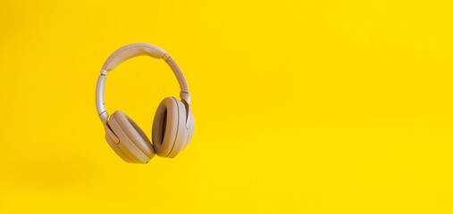 simple wireless headphones isolated floating in the air against the colorful background