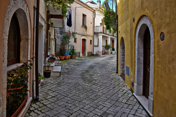 A narrow street among the old houses of Ciorlano, an old town in Caserta province, Italy.