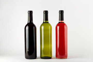 bottles of wine of different types isolated on a white background