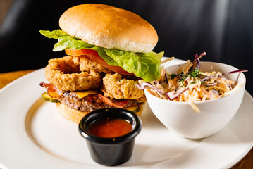 tasty burger with coleslaw salad