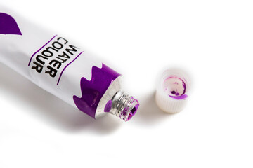 Dried Violet watercolor paint in a tube isolated on white background