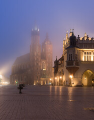 Fototapeta na wymiar Main market square, Cloth Hall and St Mary's church in the misty night, Krakow, Poland