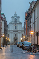 Fototapeta premium St John street in the night and piarist church, Krakow, Poland, old city