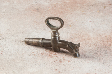 Old bronze wine barrel crane