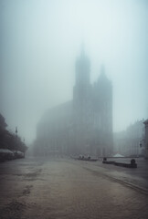 St Mary's church on Krakow Main Square in the thick fog, Poland.