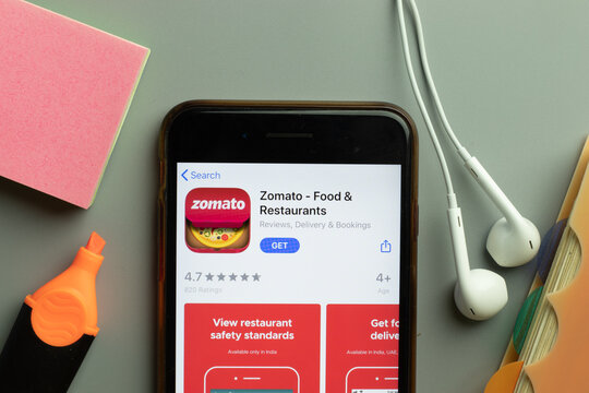 New York, USA - 1 December 2020: Zomato mobile app icon on phone screen top view, Illustrative Editorial