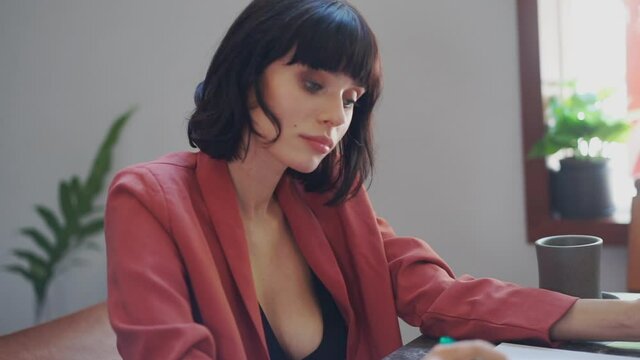 Portrait of beautiful caucasian businesswoman using tablet in cafe.